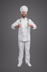 Smiling cook in chef uniform with fork and knife