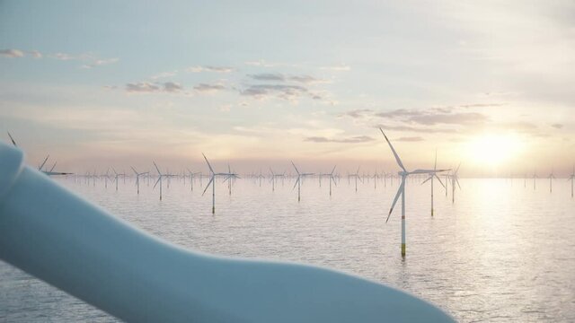 Camera pulls back through rotating blades of a wind turbine in an offshore wind farm in the sea against low sun. Green and renewable energy concept. Realistic high quality 3d animation. 