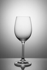 Empty wine glass for white wine on a white background.