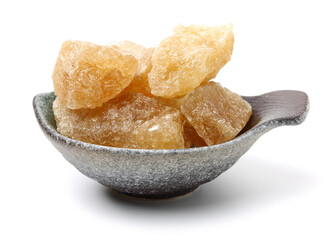 brown crystal sugar on white background