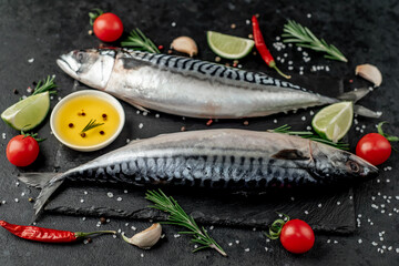 Fresh raw mackerel fish on stone background
