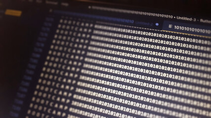 Digital binary code data on computer screen. Hacker concept background patternt