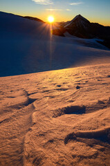Sunrise high in the mountains above the glacier