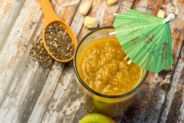 Fruit smoothie with fresh ingredients green smoothie with apple, kiwi, lime and chia seeds. healthy diet eating, superfood. Selective focus