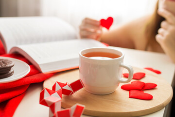 woman hands holding a cup of tea