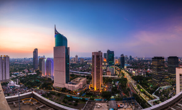 Fototapeta Jakarta skyline at the sunset time. This is the capital city of indonesia and also become the business center and administration center.