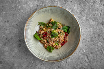 Delicate aromatic risotto with sun-dried tomatoes, grilled vegetables and sauce. Diet, vegetarian food.