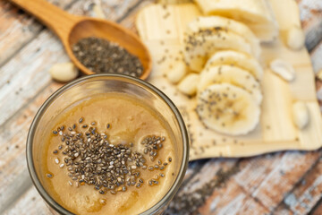 Healthy breakfast: chia seed with banana in a glass close-up on the table. horizontal. Top view. Selective focus