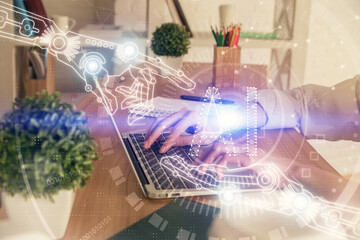 Double exposure of woman hands working on computer and data theme hologram drawing. Tech concept.