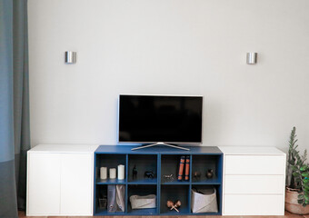 interior light gray with blue TV on the pedestal