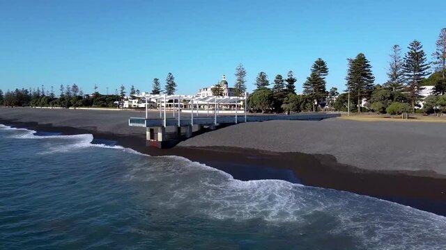 An aerial drone view of a pier and the city view of Napier in New Zealand