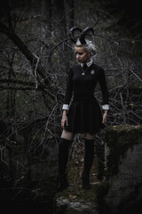 Naklejka premium Witch in the form of a student in the forest