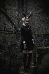 Naklejka premium Witch in the form of a student in the forest