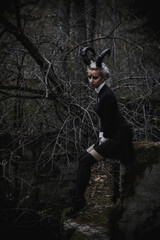 Naklejka premium Witch in the form of a student in the forest