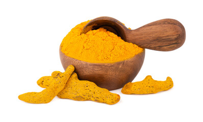 Dry turmeric powder in wooden bowl and spoon, isolated on white background. Curcuma longa linn.