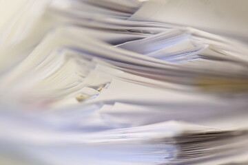 Stack of papers in the office. Close up. Documents. Files.