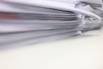 Stack of papers in the office. Close up. Documents. Files.