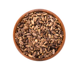 Milk Thistle seed in wooden bowl, isolated on white background. Silybum marianum, Scotch Thistle or Marian Thistle. Top view.