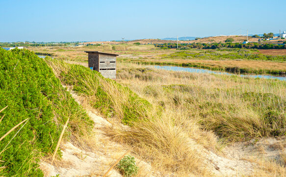 Wooden birdwatching cabin at nature reserve "Ostuni wetland" Apulia, Italy.