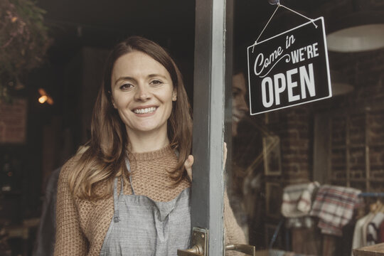 Portrait of store owner open for business