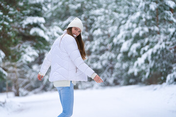 Fototapeta premium beautiful smiling young woman in wintertime outdoor. Winter concept