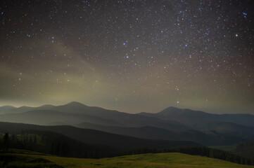Fototapeta na wymiar Beautiful starry sky in the Ukrainian mountain village in the Carpathians