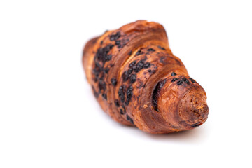 From above of delicious fresh crusty croissant and pieces of dark chocolate composed on a isolated background.