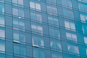 Fototapeta na wymiar Blue glass windows of modern skyscraper. Office rent, leasing concept