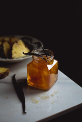 pineapple and vanilla jam in a square jar on the table
