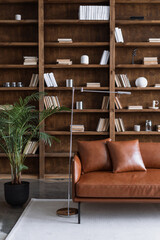 Room with comfortable couch and books on bookshelves