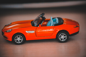 Fototapeta na wymiar red toy car on the table