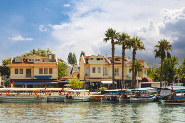 Fototapeta na wymiar Touristic River Boats moored at the pier of the Dalyan River, Mugla, Turkey.