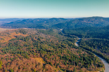 Obraz premium View of the mountains and winding highway in autumn. Beautiful nature landscape. Carpathian mountains. Ukraine