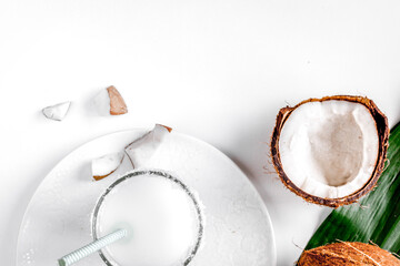 cocktail with coconut on white background top view
