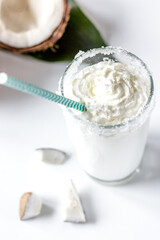 cocktail with coconut on white background