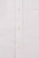 button on a white men's shirt close up