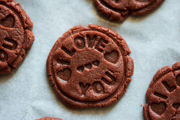 Food pattern. Raw chocolate cookies with sign I love you. Top view. Flat lay. Valentines day celebration concept