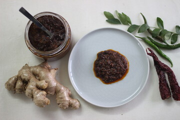 Ginger curry is a dark brown sweet-sour and spicy Keralite curry made of ginger, tamarind, green...