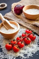 ingredients for paella on dark background