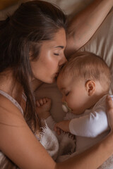 Mother and her baby sleeping together
