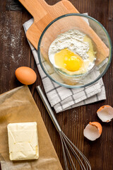 cooking pancake on wooden background top view ingredients for making