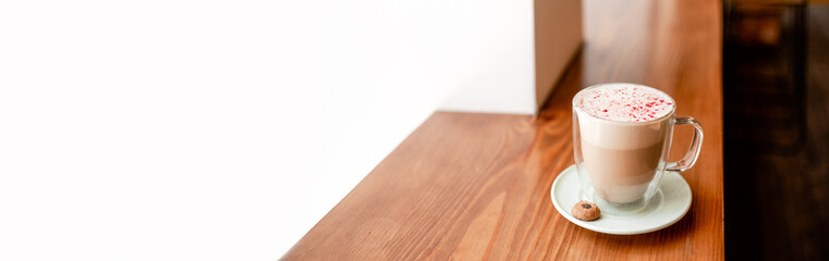 Double wall glass with fresh hot coffee. Good morning and having a break concept. Top horizontal view copyspace.