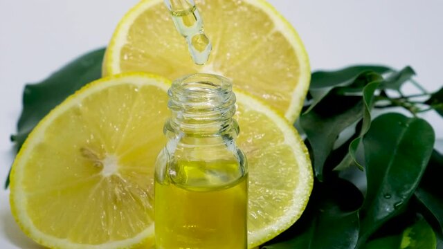 lemon essential oil in small bottles. selective focus.