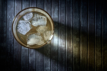 A glass of whiskey with ice. Flat Lay.