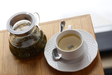 Chinese tea milk oolong served in tea pot close up photo on the table