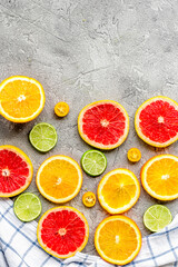 sliced citrus on stone table background top view mock up