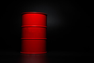 Red barrel of oil on a black background.