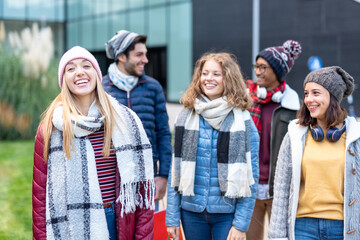 Fototapeta premium millennial people walking in the city and making shopping, focus on the smiling face of young blonde woman, friends and couple fashion addicted