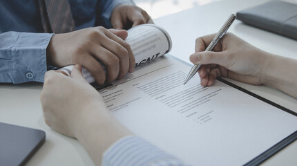 Job seeker has signed an employment contract with the employer or company HR, Signing a contract for applying for a job, Agreeing to the terms and conditions of the law.