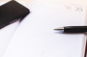 notebook and pen on the table